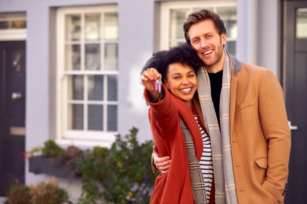 Couple at the doorway of their new Dutch home